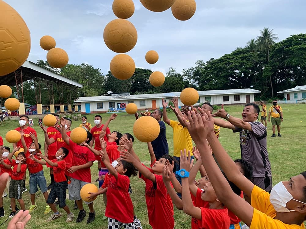 Kids participate in the Football for Peace Festival